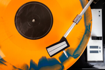 Close up of turntable needle on a vinyl