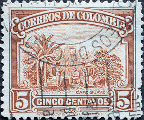 Colombia - circa 1936 : a postage stamp from Colombia, showing a coffee plantation with farmers and...