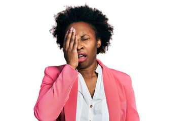 African american woman with afro hair wearing business jacket yawning tired covering half face, eye...