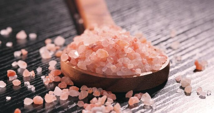 Himalayan pink salt in a wooden is used to flavor food. Due mainly to marketing costs, pink Himalayan salt is up to twenty times more expensive than table or sea salt.