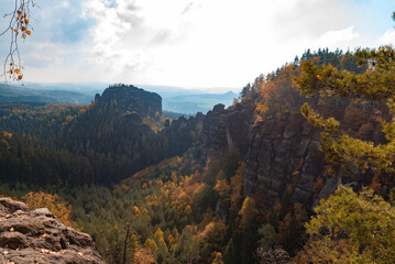 View from the mountain down to the autumn colorful forests