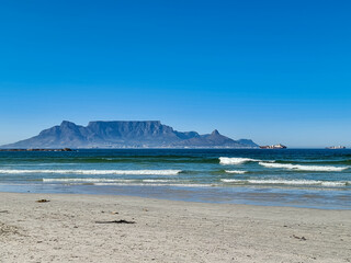 View of Table Mountain from Bloubergstrand beach on a clear summers day.