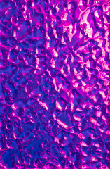 Abstract wavy surface with neon magenta and violet hues. Futuristic liquid background.