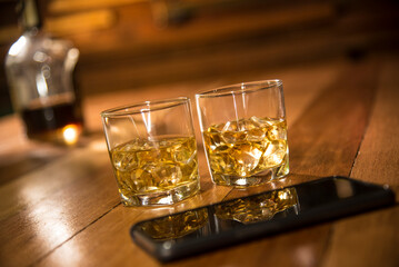 whiskey on the rock cocktail drink on wood table
