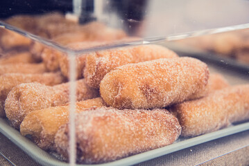 Delicious catalan typical pastry filled with cream (xuixo)