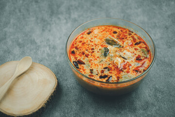 Tom Yam Spicy Thai soup with seafood, coconut milk and chili pepper.