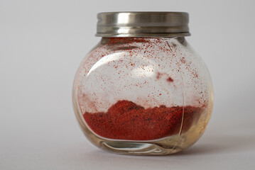 Dried red paprika in a glass jar

