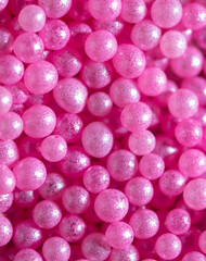 Small sweet pink balloons as a background.