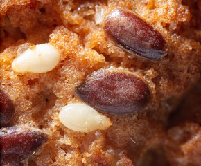 Sesame seeds on a ruddy cupcake.