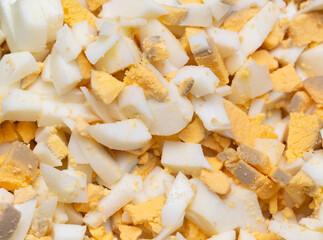 Sliced boiled eggs as a background.