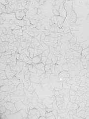 Cracked white paint on the wall as an abstract background.