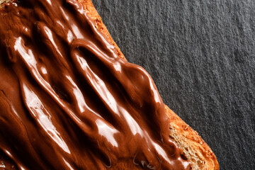 Hazelnut cream spread on a slice of wholemeal bread.