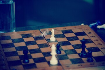 chess pieces  on an old   board