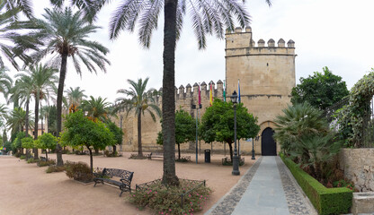 Exterior view at the Alcázar of the Christian Monarchs fortress or Alcázar of Córdoba, a medieval alcázar located in the historic centre of Córdoba, Spain - obrazy, fototapety, plakaty