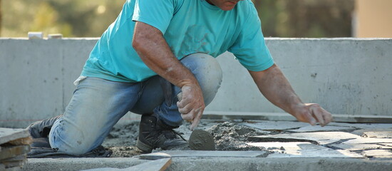 worker cutting concrete