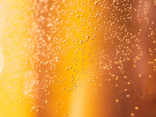 small bubbles in orange yellow liquid - use as background - color gradient