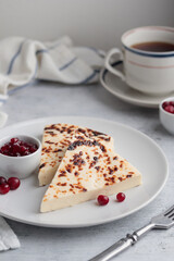 Leipajuusto - traditional Finnish baked cheese - with berries