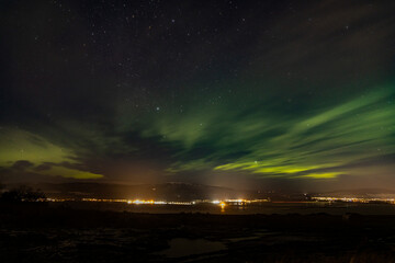 Aurora borealis above Alness and the Cromarty Firth in the north east highlands of Scotland near Inverness during winter
