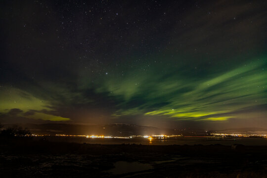 Aurora borealis above Alness and the Cromarty Firth in the north east highlands of Scotland near Inverness during winter