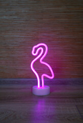 Pink Flamingo LED Night Light. Stylish lamp made of flexible neon. Trendy silhouette with empty space.