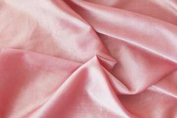 Pink fabric, natural silk lined with folds, top view, background for romantic congratulations