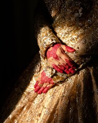 hands of the woman with henna at her wedding