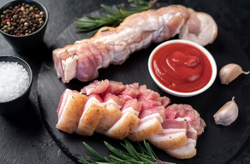 homemade lard with spices on a stone background