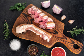 homemade lard with spices on a stone background