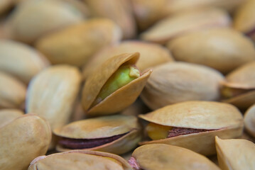 Green pistachios inside the shell close up