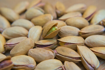 Green pistachios inside the shell close up