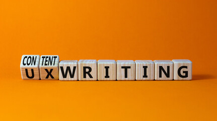 Content or UX writing symbol. Turned wooden cubes changed concept words content writing to UX writing. Beautiful orange background copy space. Business content or UX user experience writing concept.