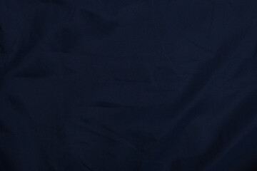 Blue fabric texture, background. folds close up. classic blue pantone