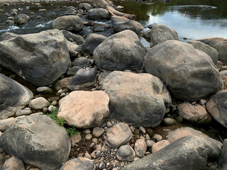 Fototapeta na wymiar Gray stones in the river.