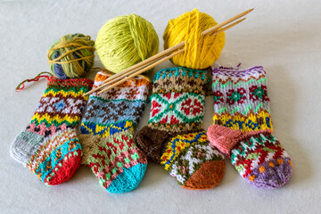 handicraft concept, colorful knitted socks, knitting as a hobby