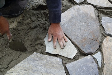 Worker installing blocks