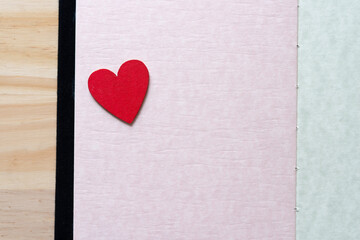 red heart on pink paper (mostly)