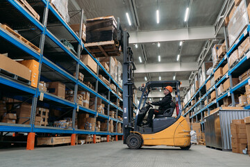 A forklift works in a warehouse.