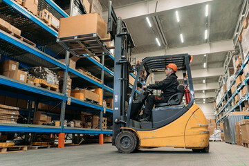 A forklift works in a warehouse.