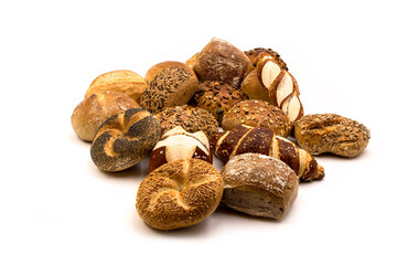 fresh baked bakery buns piled up. bunch of diffrent types of buns