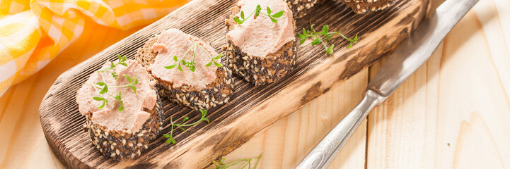 meat paste sandwiches and cress - salad on an impressive board, selective focus