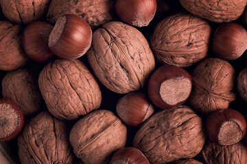 Walnut and hazelnut, close-up, top view, selective focus, toned image, rustic, food background,