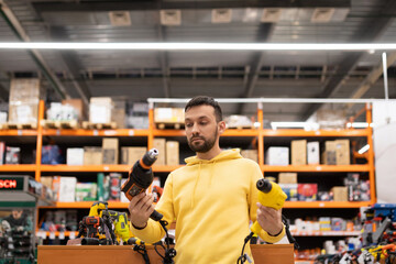 the buyer is determined between two models of screwdrivers and drills in the tool department of a hardware store