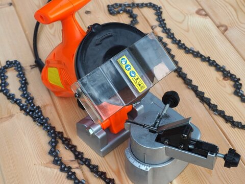 Electric chain sharpener. Chainsaw accessories and tools. Saw chain sharpening machine