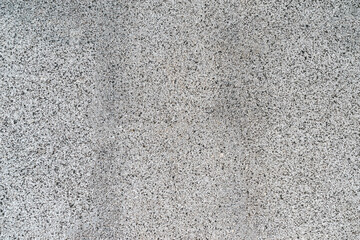 Close-up. Surface texture of natural gray granite material with mineral stone. Abstract Background Empty Seamless. View from above.