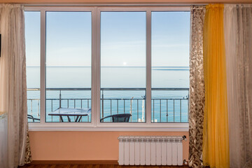 Hotel room window with sea panorama