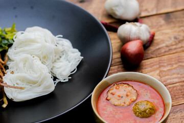 Thai vermicelli eaten with curry or Thai rice noodle with peanut sauce. It is a popular street food that Thai people eat and is widely available in Thailand.