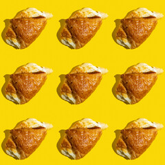 Seamless pattern with sweet cheese pastry on yellow background.