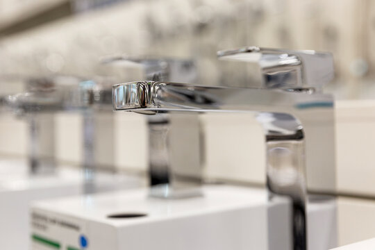 Samples of kitchen faucets in a hardware store. Close-up. Selective focus.
