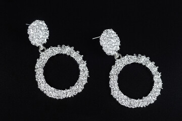 Jewelry earrings and costume jewelry on a black background
