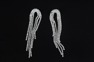 Jewelry earrings and costume jewelry on a black background